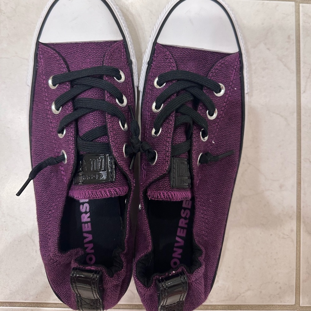 Purple and black converse